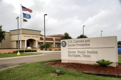 CORRECTS SPELLING TO DANAY, INSTEAD OF TANAY - FILE - The Border Patrol station stands July 11, 2014, in Harlingen, Texas. U.S. Customs and Border Protection has reassigned its chief medical officer after the in-custody death of an 8-year-old girl whose mother's pleas for an ambulance were ignored despite her daughter's chronic heart condition, rare blood disorder, high fever and other ailments, authorities said Thursday. Anadith Danay Reyes Alvarez was moved with family to a Border Patrol stati