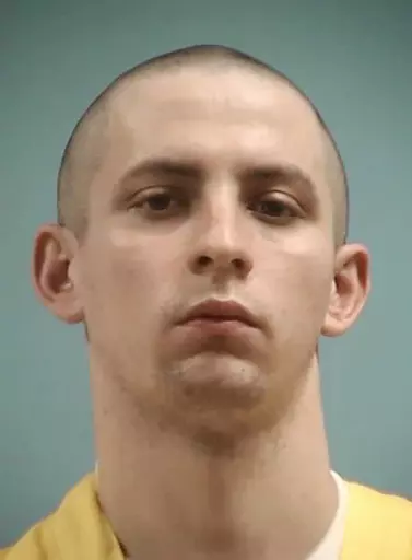 This image provided by the Mississippi Department of Corrections shows Axel Cox, 24, of Gulfport, Miss. Cox, who burned a cross in his front yard to intimidate his Black neighbors in December 2020, was sentenced Thursday, March 9, 2023, to 42 years in prison. (Mississippi Department of Corrections via AP, File)