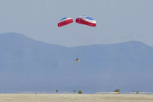 Boeing's CST-100 Starliner spacecraft lands at White Sands Missile Range's Space Harbor, Wednesday, May 25, 2022, in New Mexico. (Bill Ingalls/NASA via AP)