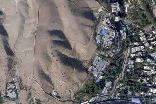 This satellite photo from Planet Labs PBC shows Evin prison in Tehran, Iran, Sunday, Oct. 16, 2022, after a fire at the complex amid ongoing national protests in the country. Iran's judiciary raised the death toll Monday, Oct. 17, 2022, in a blaze at the prison, saying that at least eight prisoners were killed. (Planet Labs PBC via AP)