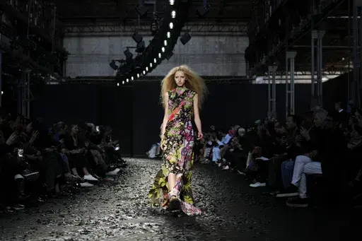 A model wears a creation as part of the Moschino Fall/Winter 2025-2026 Womenswear collection presented in Milan, Italy, Friday, Feb. 28, 2025. (AP Photo/Luca Bruno)