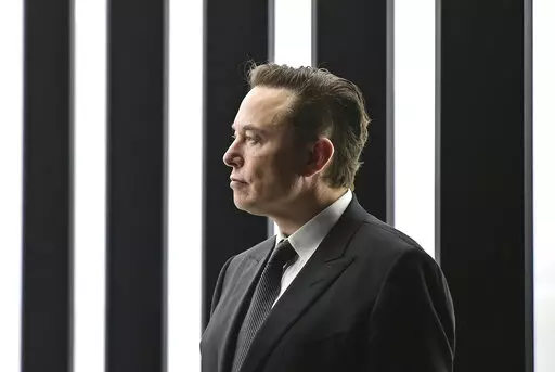 Elon Musk, Tesla CEO, attends the opening of the Tesla factory Berlin Brandenburg in Gruenheide, Germany, March 22, 2022. Musk, the world's richest man and the owner of SpaceX and Tesla, says he is a free speech absolutist who doesn't support the kind of content moderation that saw people like ex-President Donald Trump get banned for inciting violence (Patrick Pleul/Pool via AP, File)
