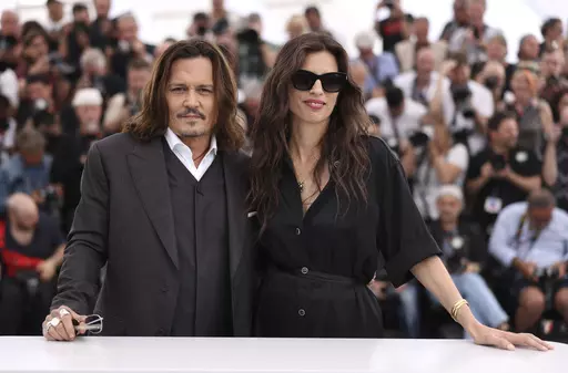 Johnny Depp, left, and director Maiwenn pose for photographers at the photo call for the film 'Jeanne du Barry' at the 76th international film festival, Cannes, southern France, Wednesday, May 17, 2023. (Photo by Vianney Le Caer/Invision/AP)