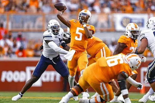 Tennessee quarterback Hendon Hooker (5) throws to a receiver during the first half of an NCAA college football game against Akron, Saturday, Sept. 17, 2022, in Knoxville, Tenn. (AP Photo/Wade Payne)