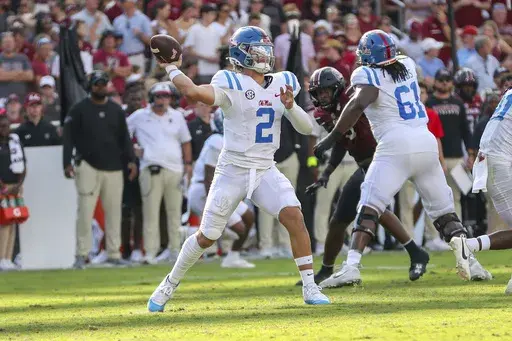 Mississippi quarterback Jaxson Dart (2) throws a pass for a first down during the first half of an NCAA college football game against South Carolina Saturday, Oct. 5, 2024, in Columbia, S.C. (AP Photo/Artie Walker Jr.)