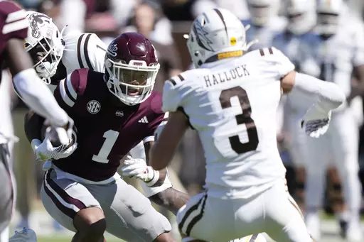 Mississippi State wide receiver Zavion Thomas (1) takes a pass upfield for a first down against Western Michigan safety Tate Hallock (3) during the second half of an NCAA college football game, Saturday, Oct. 7, 2023, in Starkville, Miss. Mississippi State won 41-28. (AP Photo/Rogelio V. Solis)