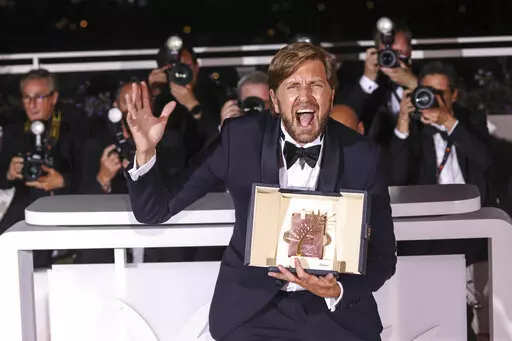 Writer/director Ruben Ostlund, winner of the Palme d'Or for 'Triangle of Sadness,' poses for photographers during the photo call following the awards ceremony at the 75th international film festival, Cannes, southern France, Saturday, May 28, 2022. (Photo by Vianney Le Caer/Invision/AP)