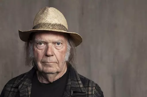 Neil Young poses for a portrait at Lost Planet Editorial in Santa Monica, Calif. on Sept. 9, 2019.  Young isn't satisfied with urging his fellow musicians to join him in taking their music off the streaming service Spotify. Now he wants company employees to quit their jobs before it “eats up your soul." In a message on his website Monday, Feb. 7, 2022, Young said company CEO Daniel Ek is a bigger problem than popular podcaster Joe Rogan.  (Photo by Rebecca Cabage/Invision/AP, File)