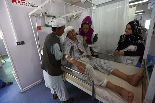 In this Wednesday, May 20, 2015 photo an Afghan boy recovers at a Medecins Sans Frontieres hospital in Kunduz province, north of Kabul, Afghanistan. On Saturday, Dec. 26, 2022, Taliban authorities announced the exclusion of women from NGOs, allegedly because they weren't wearing the headscarf, or hijab, correctly. The move prompted international aid agencies to halt operations in Afghanistan, raising the possibility that millions of people will be left without food, education, health care and ot