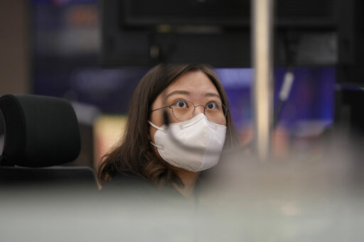 A currency trader watches computer monitors at a foreign exchange dealing room in Seoul, South Korea, Thursday, April 28, 2022. (AP Photo/Lee Jin-man)
