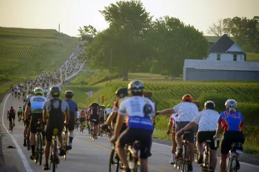Riders roll out of Tama-Toledo, Iowa, during RAGBRAI 50, Friday, July 28, 2023. (Zach Boyden-Holmes/The Des Moines Register via AP)
