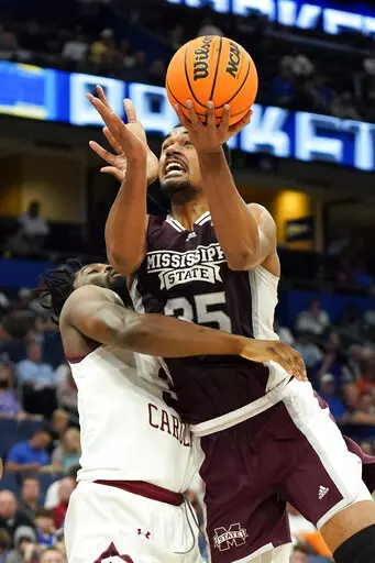 Mississippi State forward Tolu Smith goes up to shoot against South Carolina forward Josh Gray during the first half of an NCAA men's college basketball game at the Southeastern Conference tournament in Tampa, Fla., Thursday, March 10, 2022. (AP Photo/Chris O'Meara)