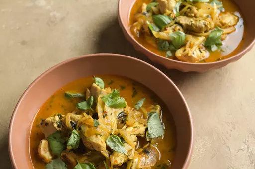 This image released by Milk Street shows a recipe for braised chicken with fennel and saffron. (Milk Street via AP)
